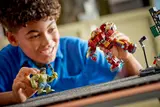 Child playing with Hulkbuster and Hulk.