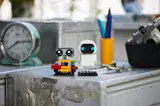 WALL•E and EVE on a desk.