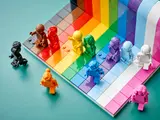 Overhead view of LEGO rainbow set with scattered minifigures.
