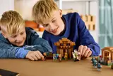 Child playing with minifigures.