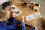 Kids building with instructions.