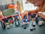 Child playing with F1 garage.