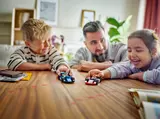 Family playing with LEGO F1 cars