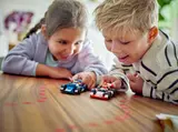 Kids playing with LEGO F1 cars