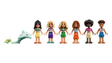 Line-up of LEGO Friends minifigures, a dolphin, and a turtle.