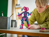 Child holding built Galactus.