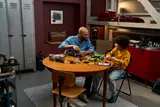 Two people building Technic Eclipse in garage.