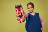 Girl presenting LEGO Ferrari 499P.