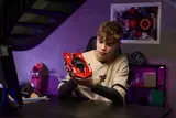 Holding the Ferrari FXX K model.