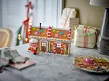 Gingerbread House in holiday setting.
