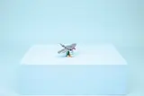 LEGO manta ray on blue cube.