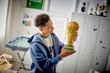 Man holding LEGO trophy