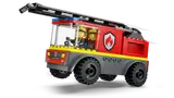 Fire truck mid-jump with two firefighters inside.