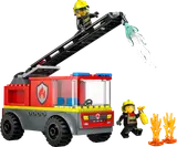 Fire truck with extended ladder and two firefighters.