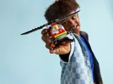 Child playing with LEGO helicopter.