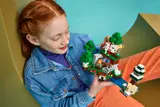 Hands holding detailed Minecraft LEGO set.