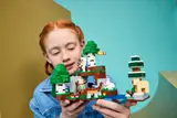 Child engaged with Minecraft LEGO set.