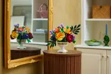 LEGO bouquet on a table, reflected in a mirror.