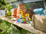 LEGO parrots on a shelf.