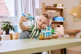 Child playing with seaplane.