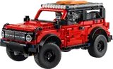 Red LEGO Technic Ford Bronco with roof rack.