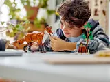Child playing with LEGO fox.