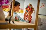 Girl holding closed set.