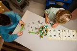 Kids building the Fox Guardian Mech.
