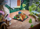 LEGO snails on a desk.