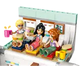 Minifigures relaxing inside camper beds.