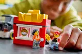 Child opening LEGO Fries Truck roof.