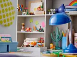 LEGO builds displayed on a shelf and desk.