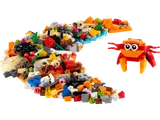 Pile of colorful LEGO bricks with a crab build.