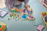 Child playing with LEGO Water Park set from above.