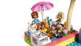 Mini-dolls relaxing by pool with ice cream.