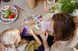 Adult and child building LEGO