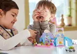 Children playing with LEGO Gabby's Dollhouse.