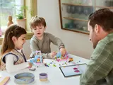 Family building LEGO Gabby's Dollhouse.