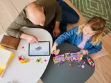 Building LEGO with digital instructions.