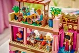 Upper floors with balconies and minifigures.