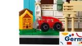Half-timbered house and red car close-up.