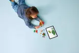 Child using digital instructions.