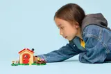 Child playing with the LEGO set.