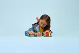 Child arranging set elements.
