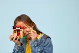 Child embracing the LEGO house.