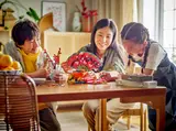 Family interacting with LEGO set.