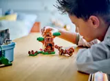 Child playing with LEGO Goomba's Playground set.