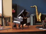 Completed LEGO Grand Piano on desk, music in background.