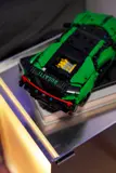 Close-up of green LEGO Technic Bugatti Chiron's detailed rear on display.