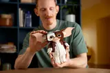 Man admiring LEGO Gizmo.